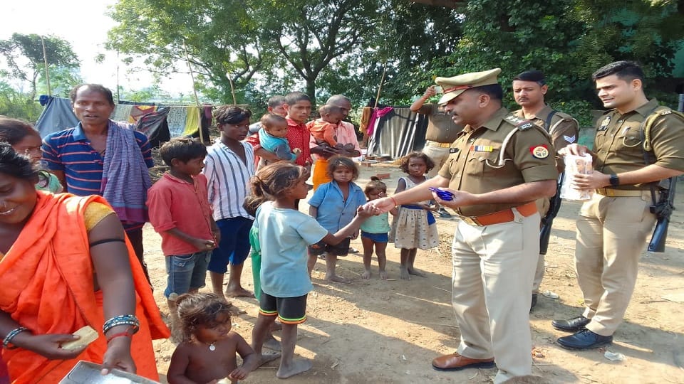 Children faces lit up after receiving sweets, chocolates and biscuits