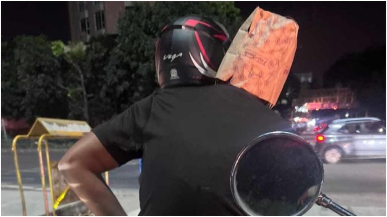Bengaluru man wears paper bag as helmet photo viral in social media