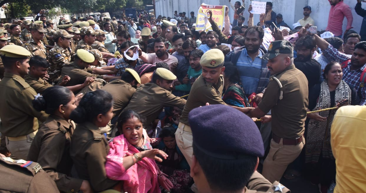 Applicants protest near education minister house in Lucknow.