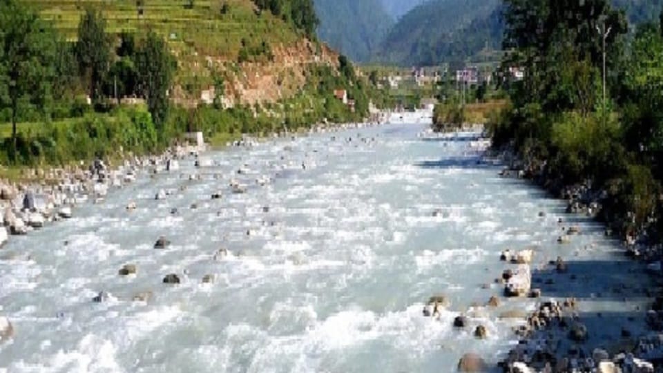 Road built in the middle of sarayu river for mining in bageshwar