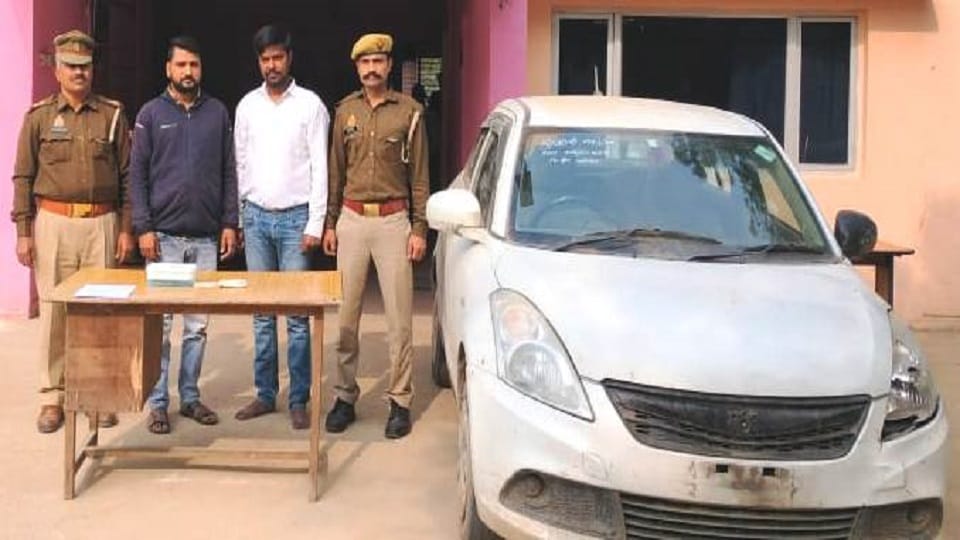 Two accused arrested with looted car