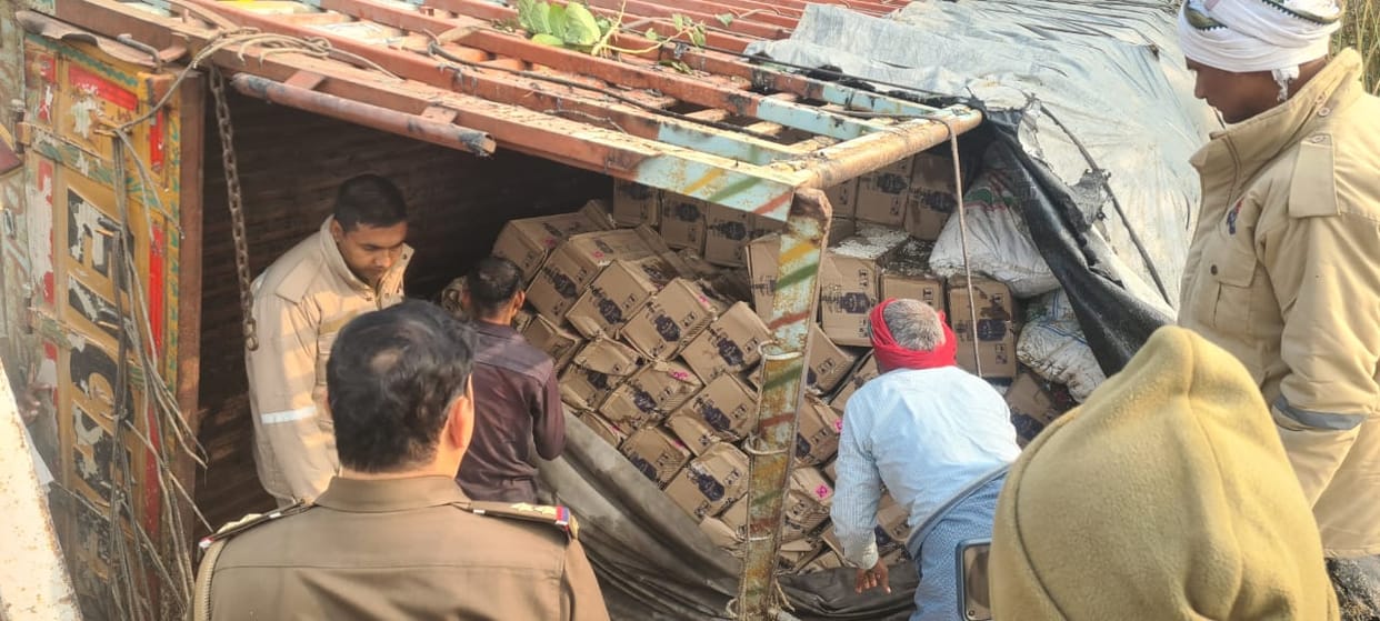DCM truck laden with English liquor overturned, riders ran away after setting it on fire; hid between sacks of