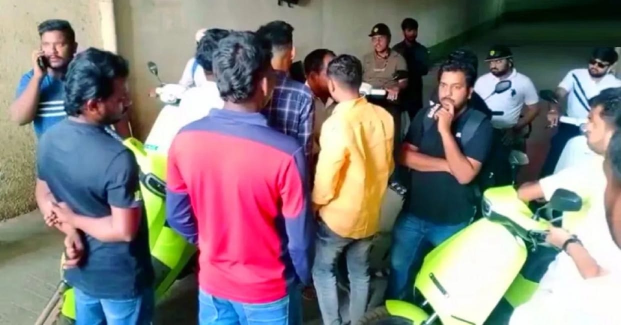 Dissatisfied Ola electric scooter customers protest in front of Ola showroom in Hubbali