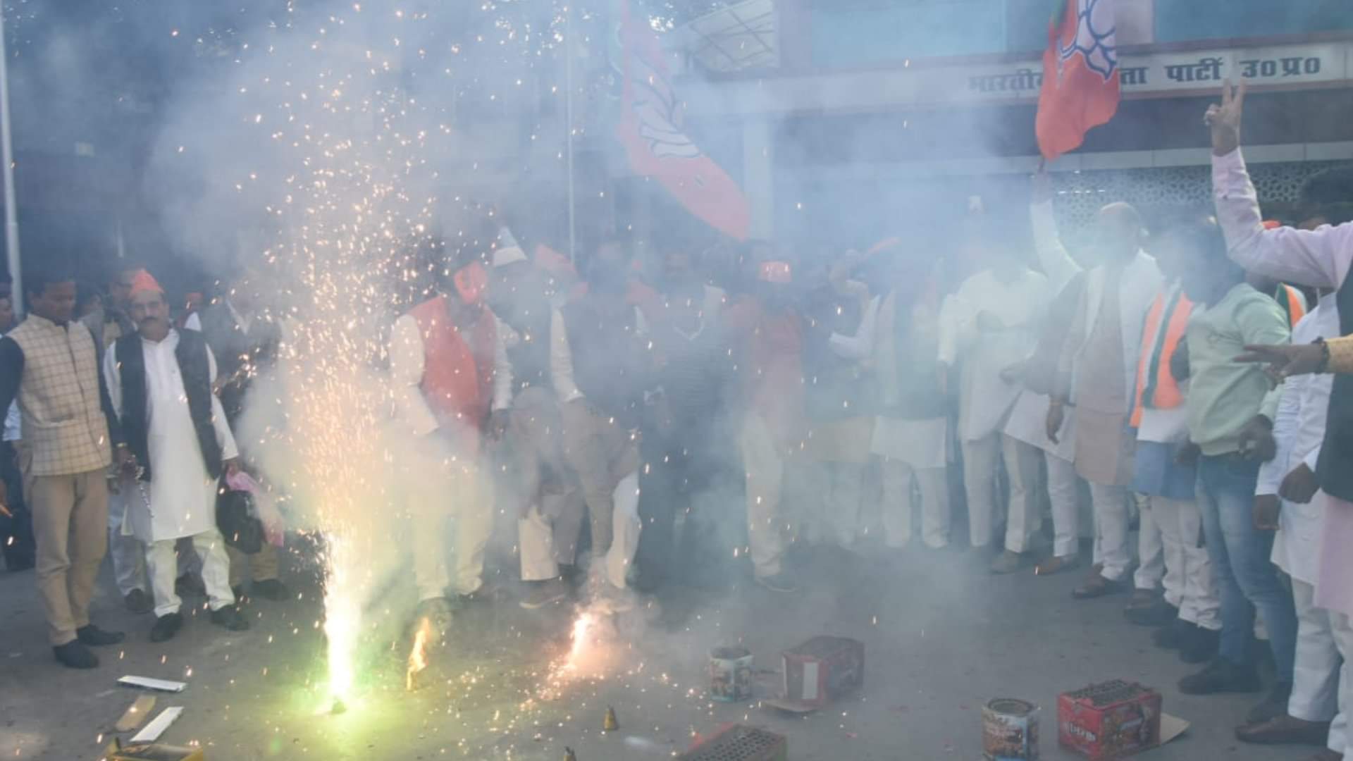 BJP activists celebrate victory in three states in party head quarter in Lucknow.