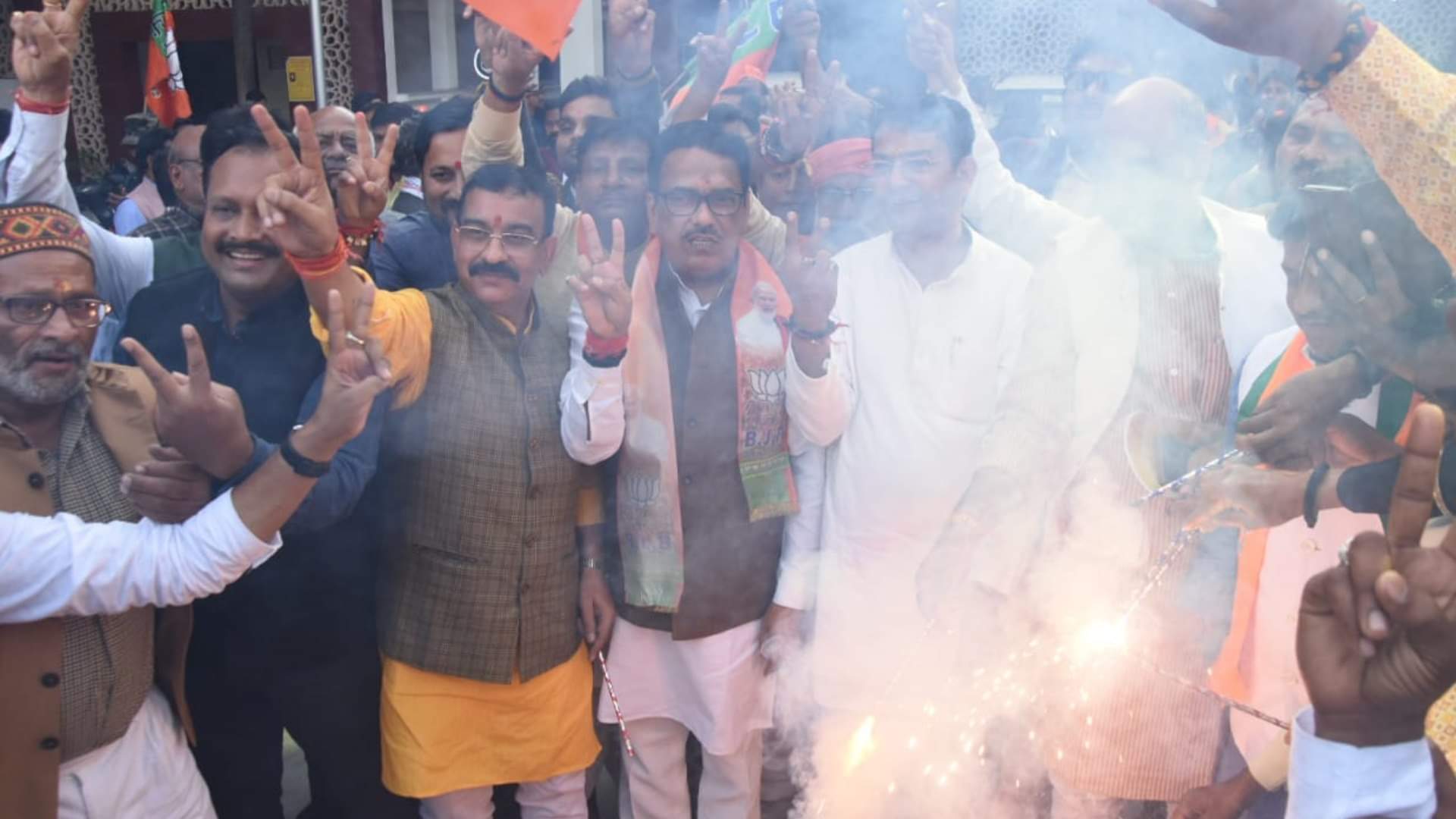 BJP activists celebrate victory in three states in party head quarter in Lucknow.