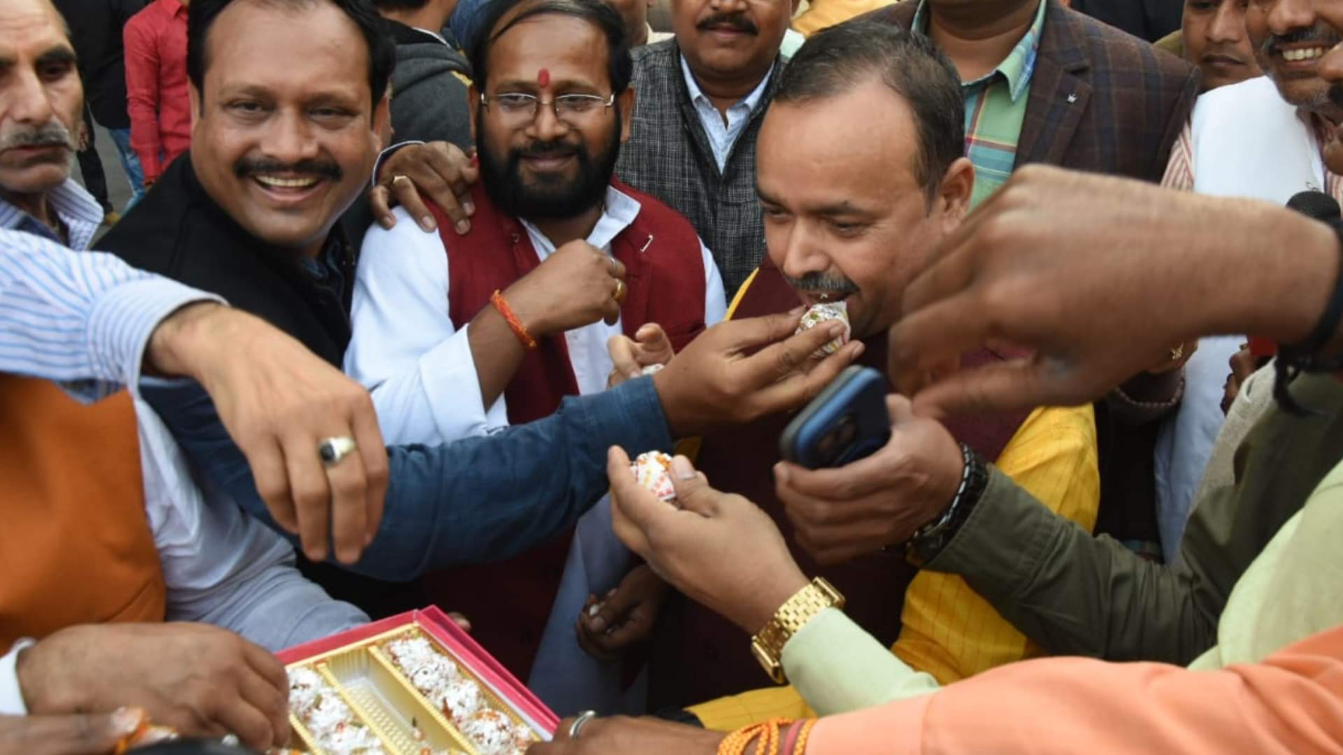 BJP activists celebrate victory in three states in party head quarter in Lucknow.