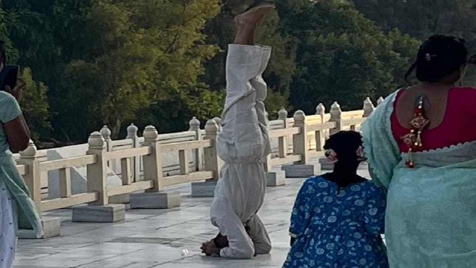 Tourist yoga on main dome of Taj Mahal photo went viral