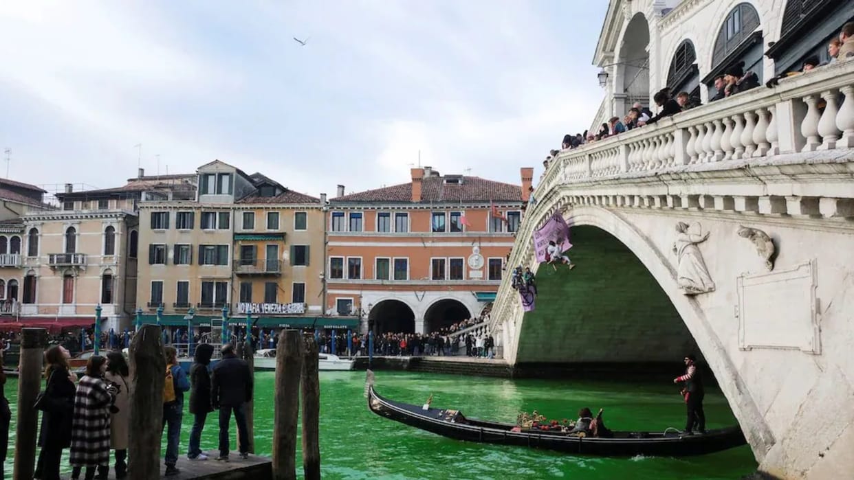 Climate Change Protesters used a dye to turn Venice's Grand Canal green COP28 climate summit