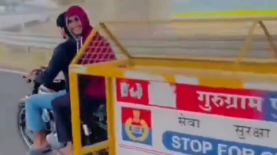 two bike riding youths made a reel by pulling police barricade In Gurugram