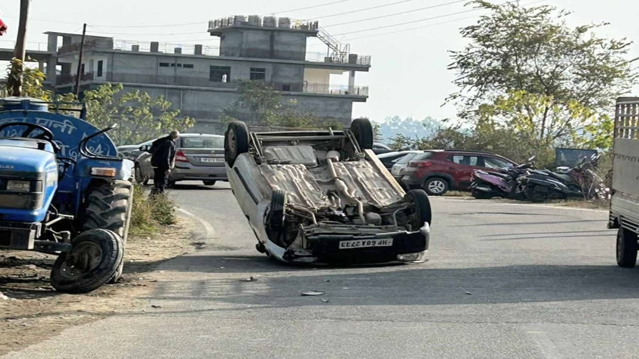Moving car overturned on the middle of the road near Hamirpur bypass.