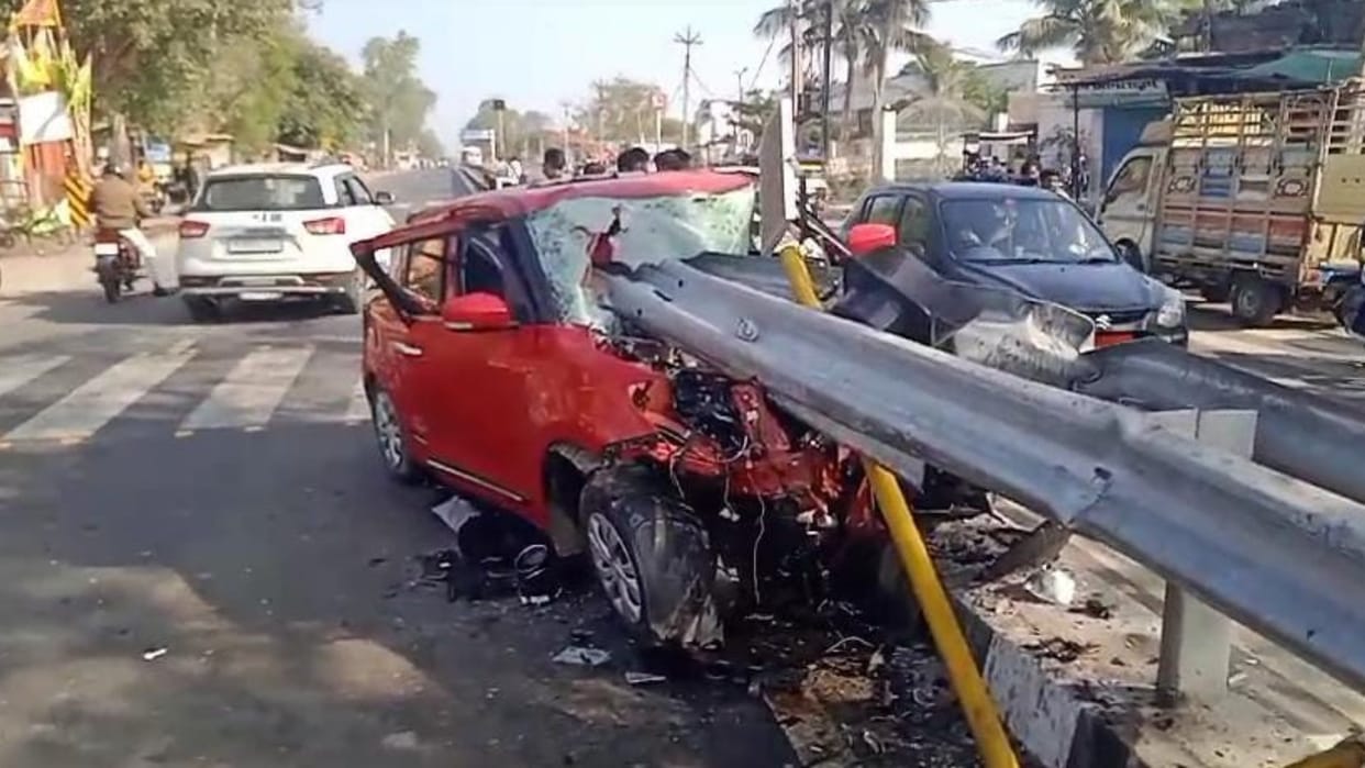 Car entered divider while trying to save cow
