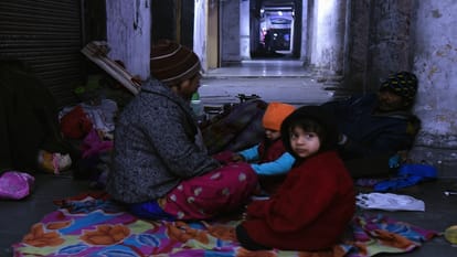 Delhi Homeless forced to sleep on footpath in severe cold