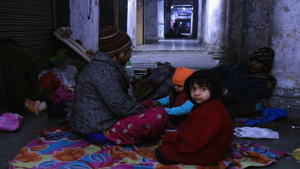 Delhi Homeless forced to sleep on footpath in severe cold