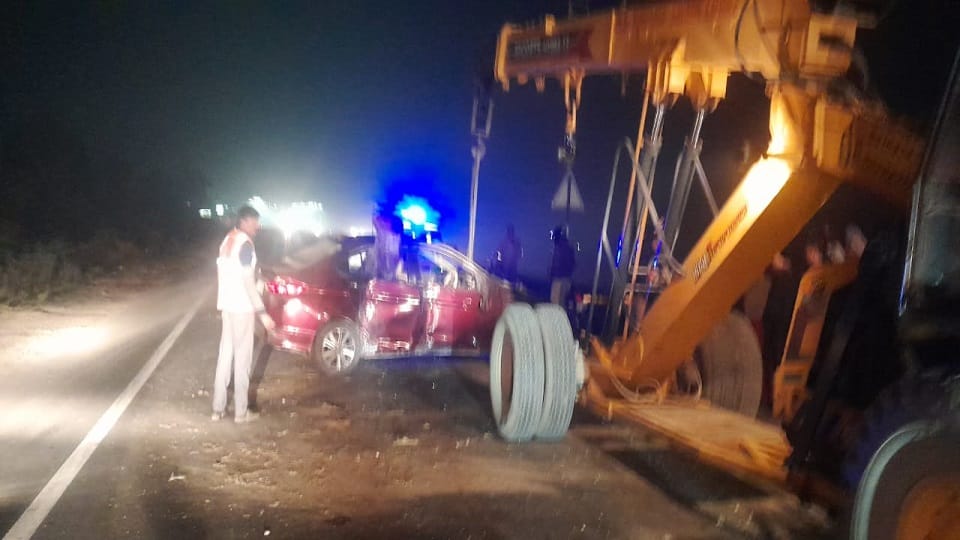 Speeding car collides with divider