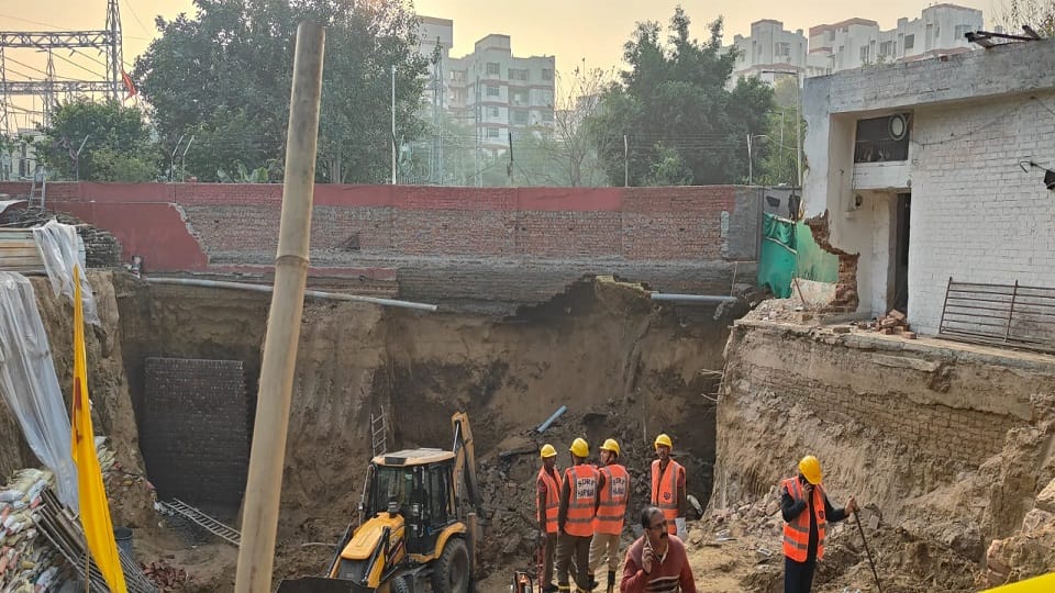 Five workers are feared trapped after the wall of a temple collapsed in Gurugram