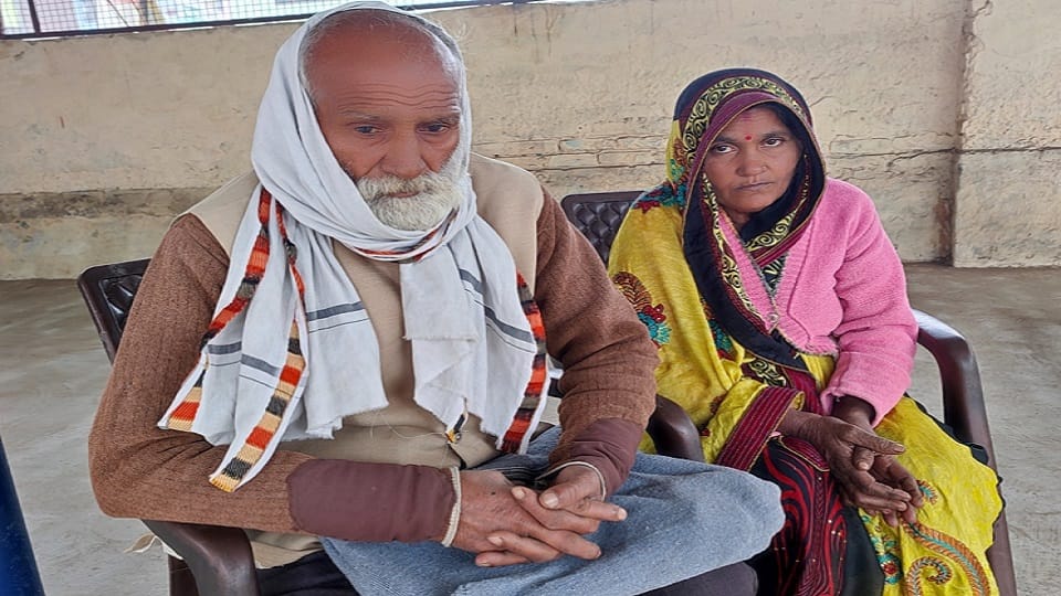 Old couple wandering from door to door to get the occupied land