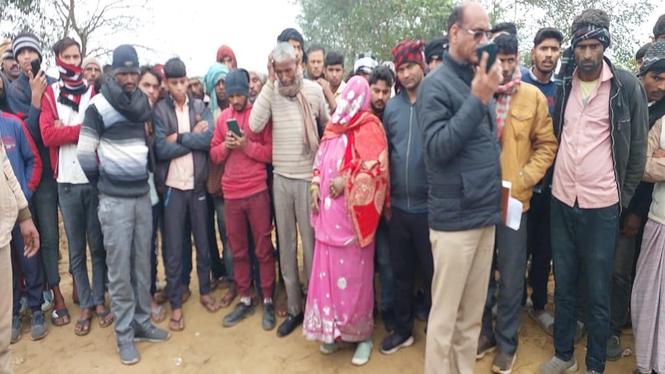 Bloody body of a young man found lying on the unpaved road