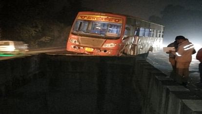 After collision with truck roadways bus hangs in air on culvert in Bareilly