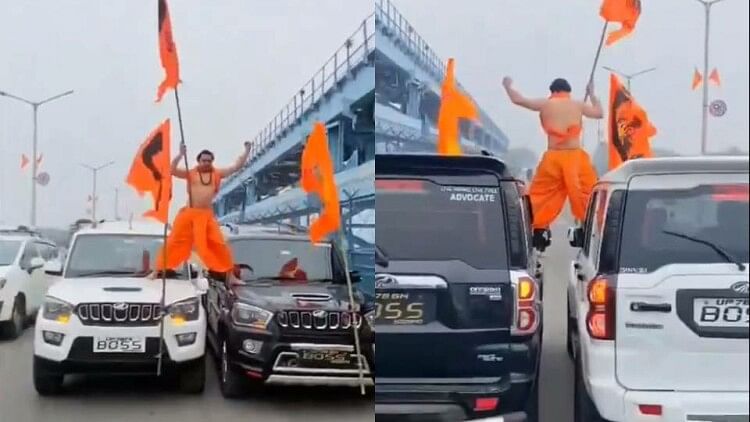 stuntman seen standing on the bonnet of Scorpio running side by side waving flag in his hand in kanpur