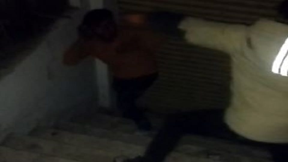 young man was taken hostage and beaten with a belt threatened to kill