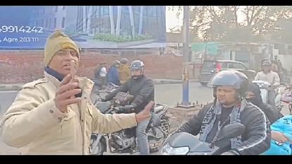 Traffic police constables give information about traffic rules to the people while on duty