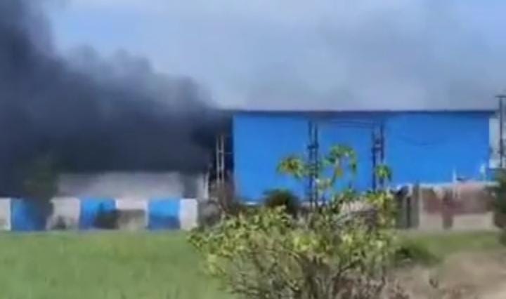 Fire in cotton ginning tracing factory, smoke visible in the distance, cotton worth lakhs and machines burnt