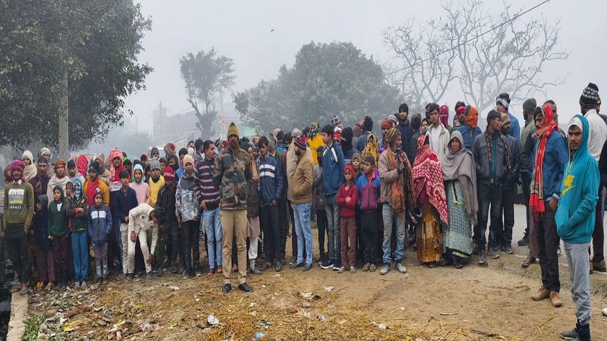man dead body found buried in pile of garbage on the roadside in Budaun