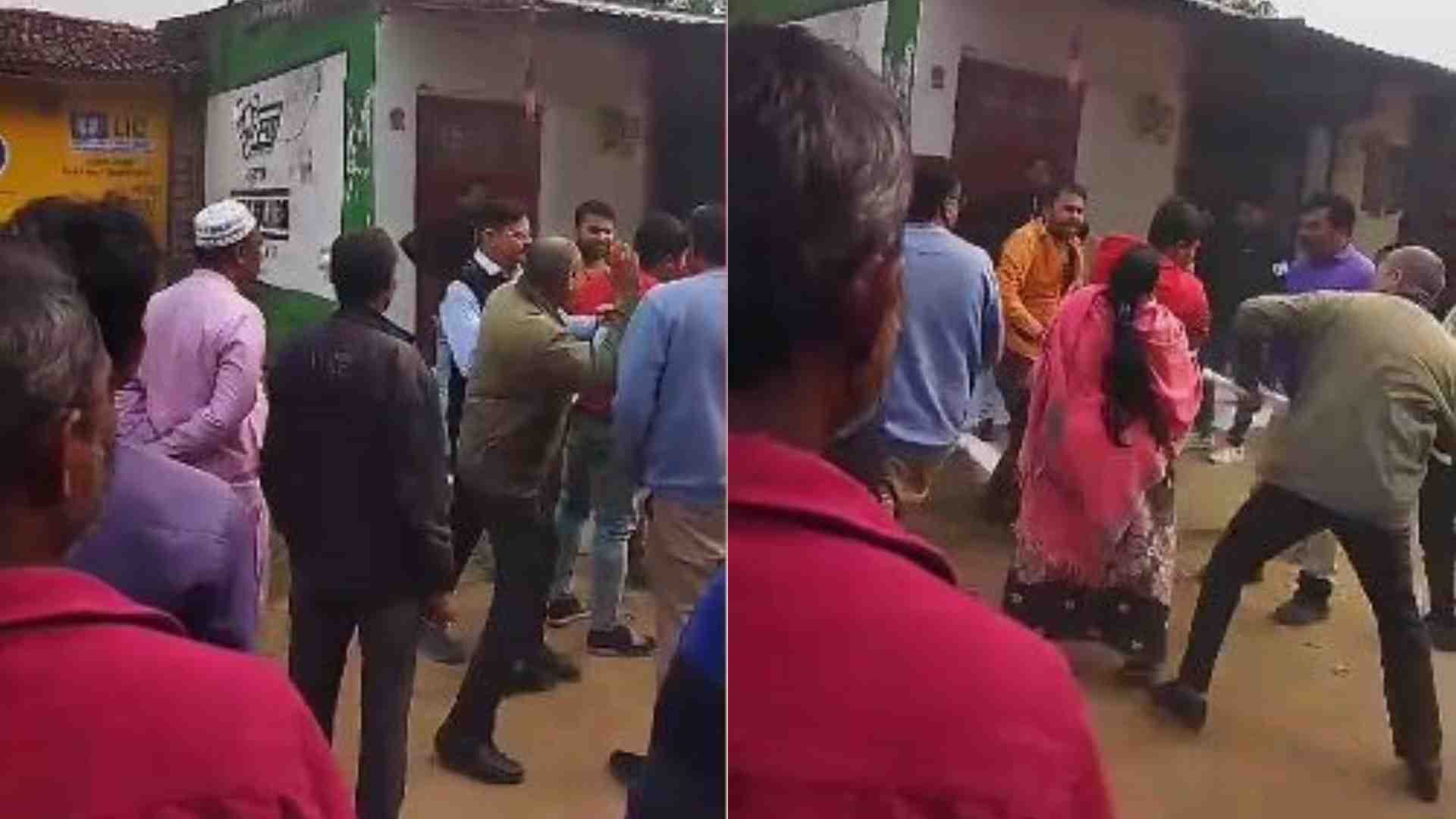 मारपीट करते कर्मचारी।