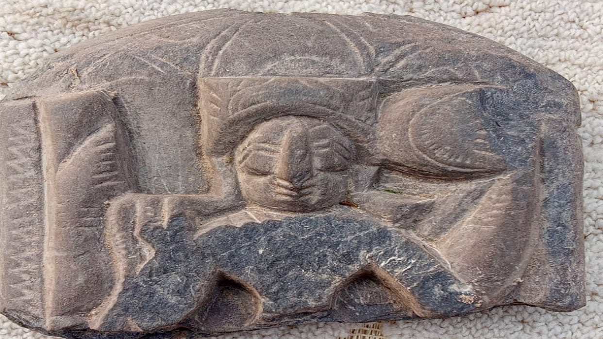 Deity of Lord Vishnu found from historical Karna Kot mound of Fatehabad, Chakra in hand and four arms visible