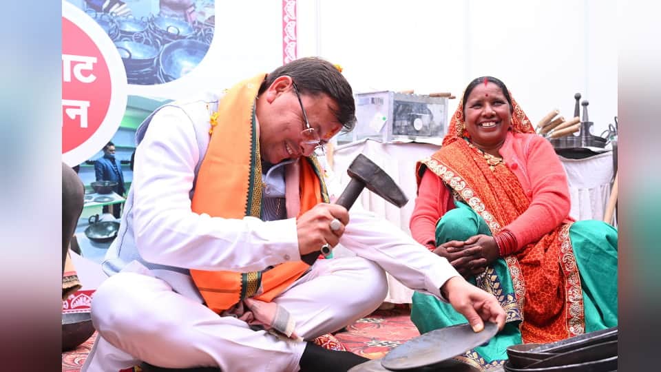 Uttarakhand CM Dhami in a different style Play Khadi Holi making Khatai with women Photos