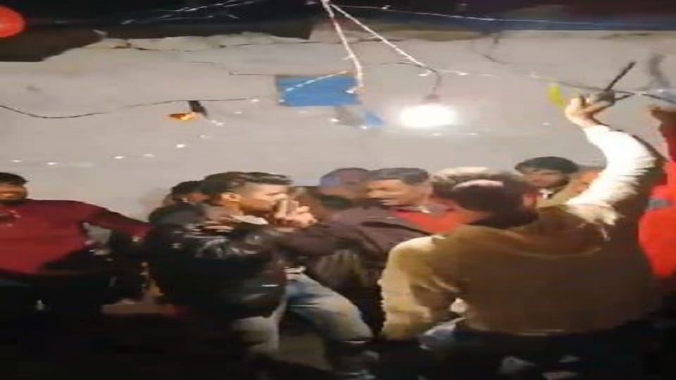 Young men were seen dancing while waving weapons in their hands