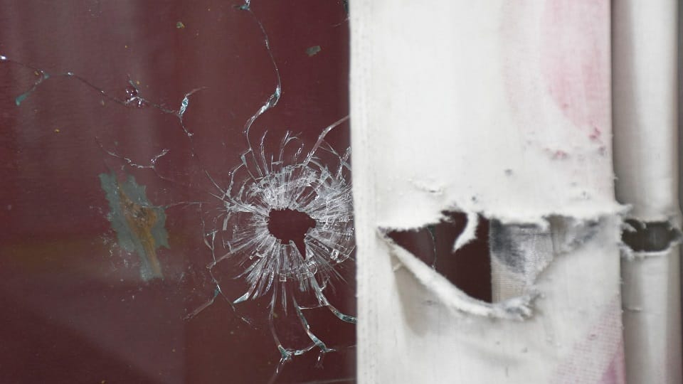 Shop glass broken by bullets, holes made on wall and shutter in Haldwani violence