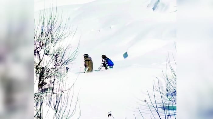 Due to heavy snowfall in Lahaul students have to walk in snow to reach the centre