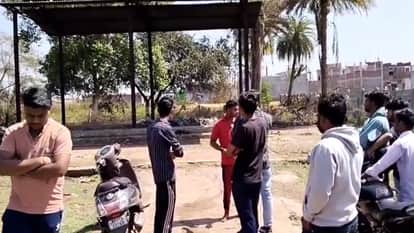 Two people caught picking up ashes from a burning pyre in Guna