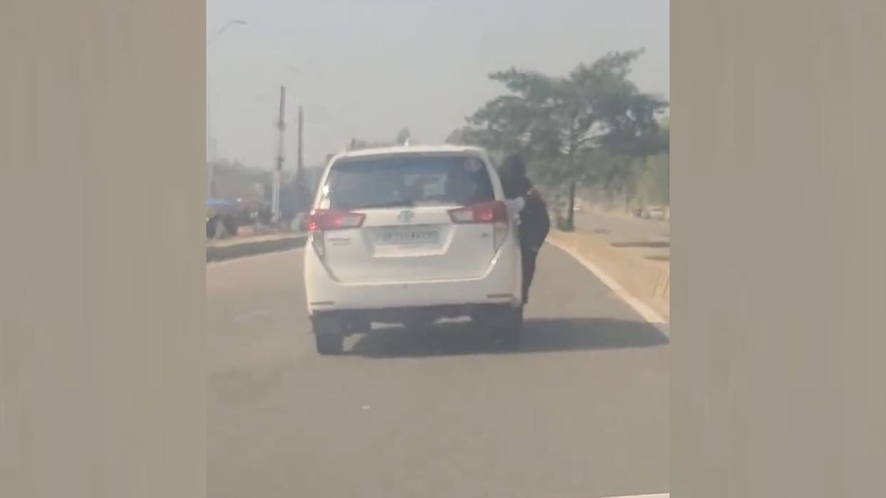 A video of a girl hanging from a car's window went viral.