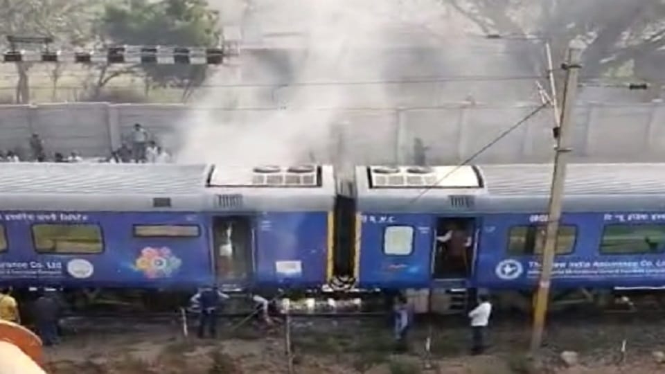 Smoke rising from the bogie of Shatabdi Express