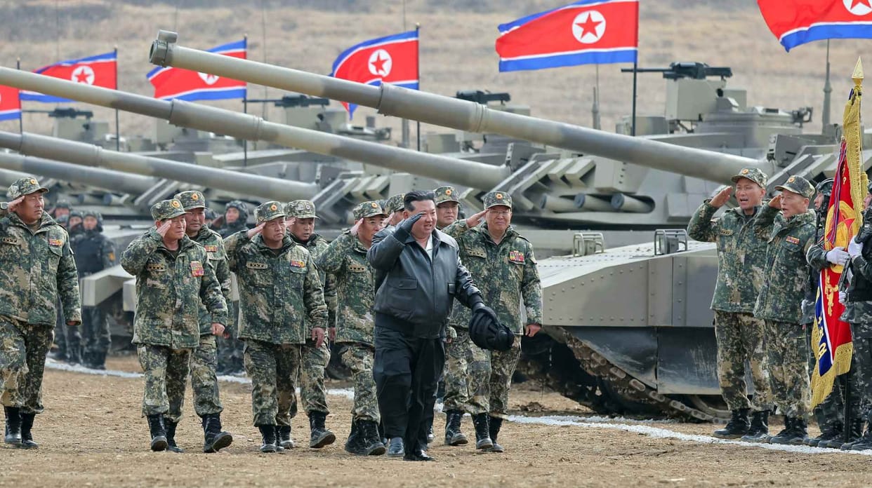Kim Jong Un In Leather Jacket Drives North Korea's New Tank In Mock Battle