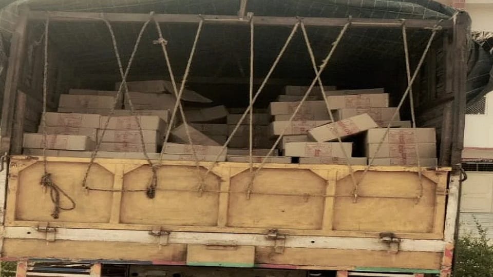 truck driver taking illegal liquor to Bihar by hiding it in a packed juice box