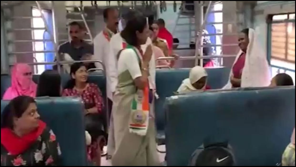 During Lok Sabha Election Campaign NCP SCP leader Supriya Sule interacts with commuters in train