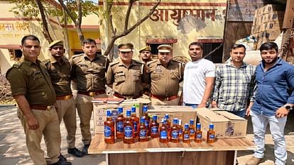 Police were surprised to see so many bottles of liquor found under sacks of peanuts in the truck