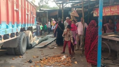 Woman dies after speeding truck hits shop