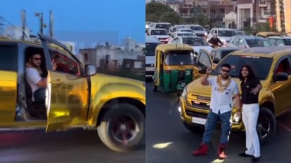 Traffic Stunt: रील शूट करने के लिए भारी-भरकम एसयूवी को बीच सड़क खड़ी कर रोका ट्रैफिक, किया स्टंट, देखें वीडियो Couple pose to shoot reels for social media blocks traffic in Delhi Viral Video