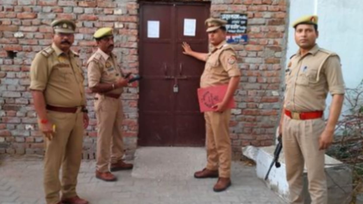 Attachment notice pasted at the house of two brothers of Atiq's shooter Abdul Kavi, action under Gangster Act.