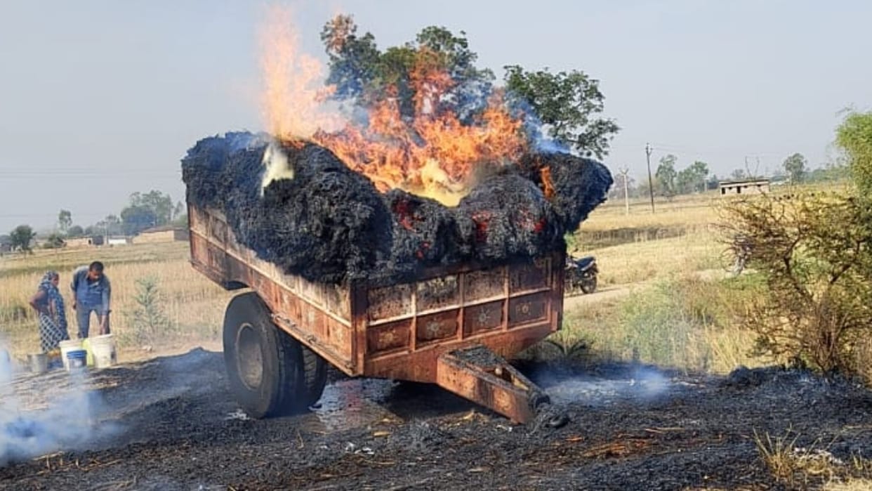 fire after hitting an electric wire in wheat loaded on tractor trolley