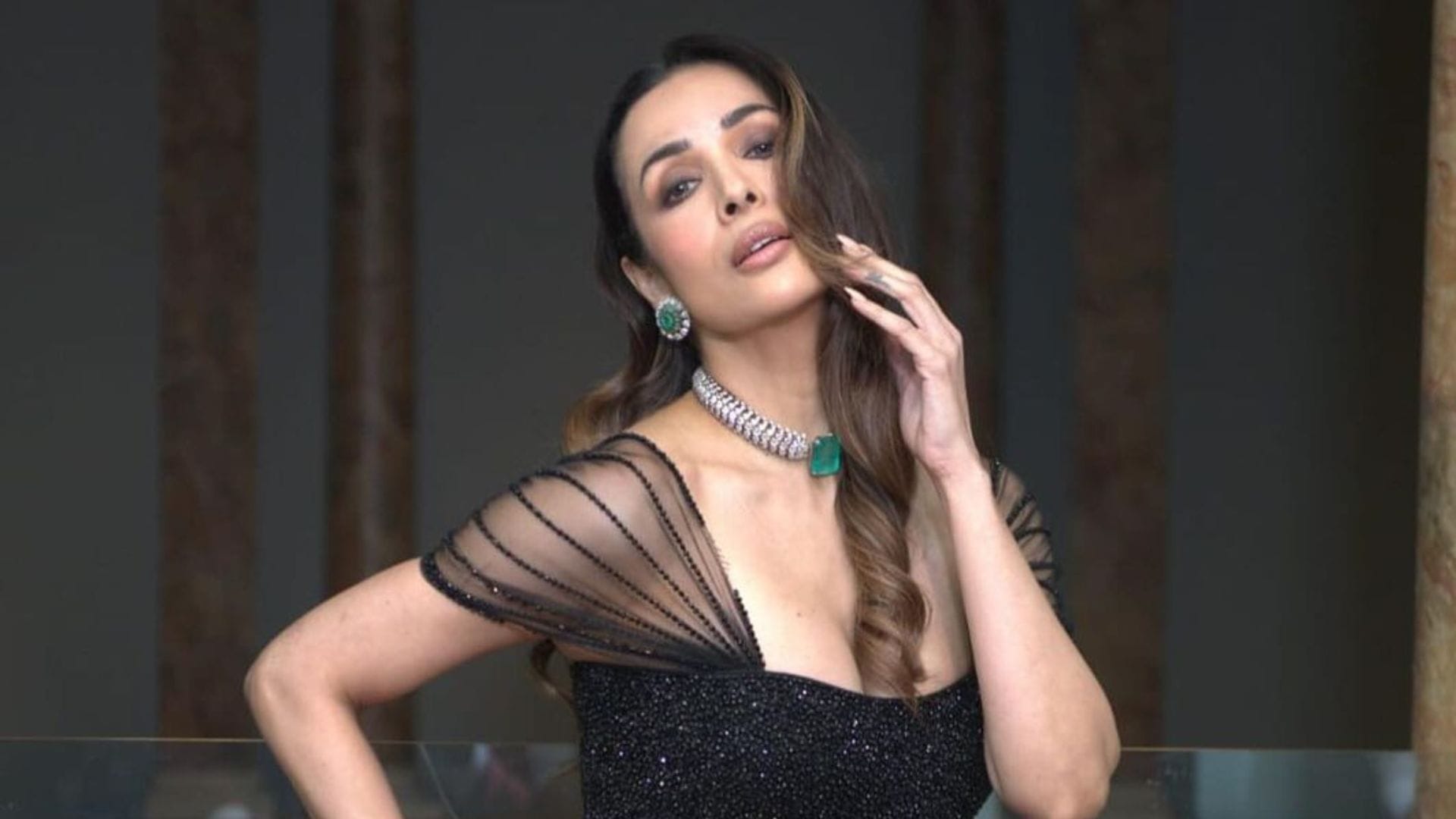 malaika arora walk the ramp in extremely bold deep neck gown