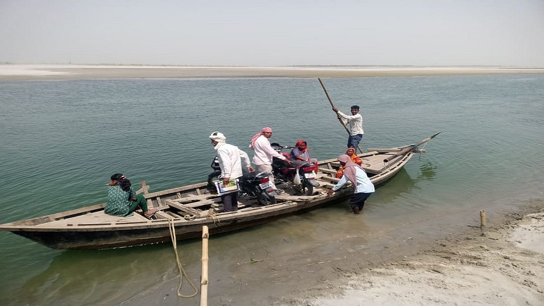 People walked eight kilometers crossed river by boat and cast their vote in Pilibhit