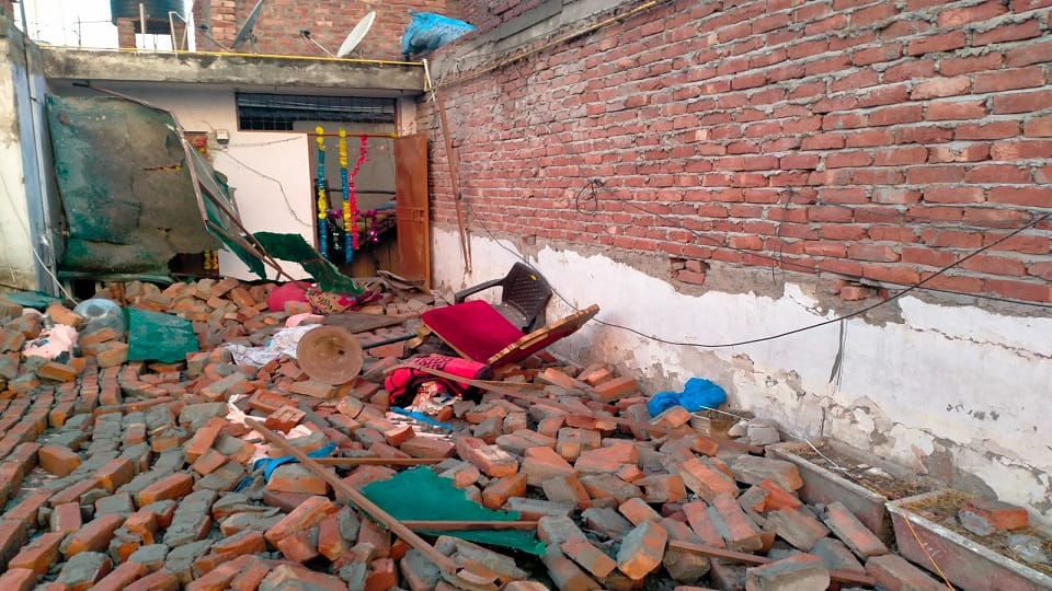 In Khirki Extension area wall being built on the fifth floor of a house broke and fell on another house