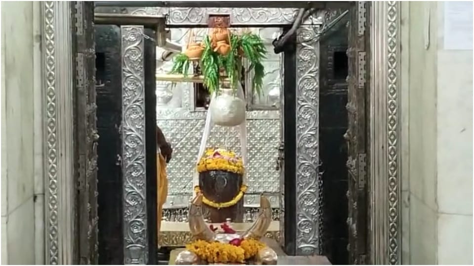 To protect Baba Mahakal from the heat water being offered from 11 pitchers on Shivling