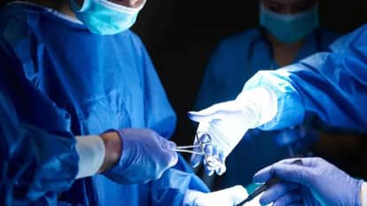 A woman had a bone lodged in her throat while eating chicken; the pieces were removed through surgery