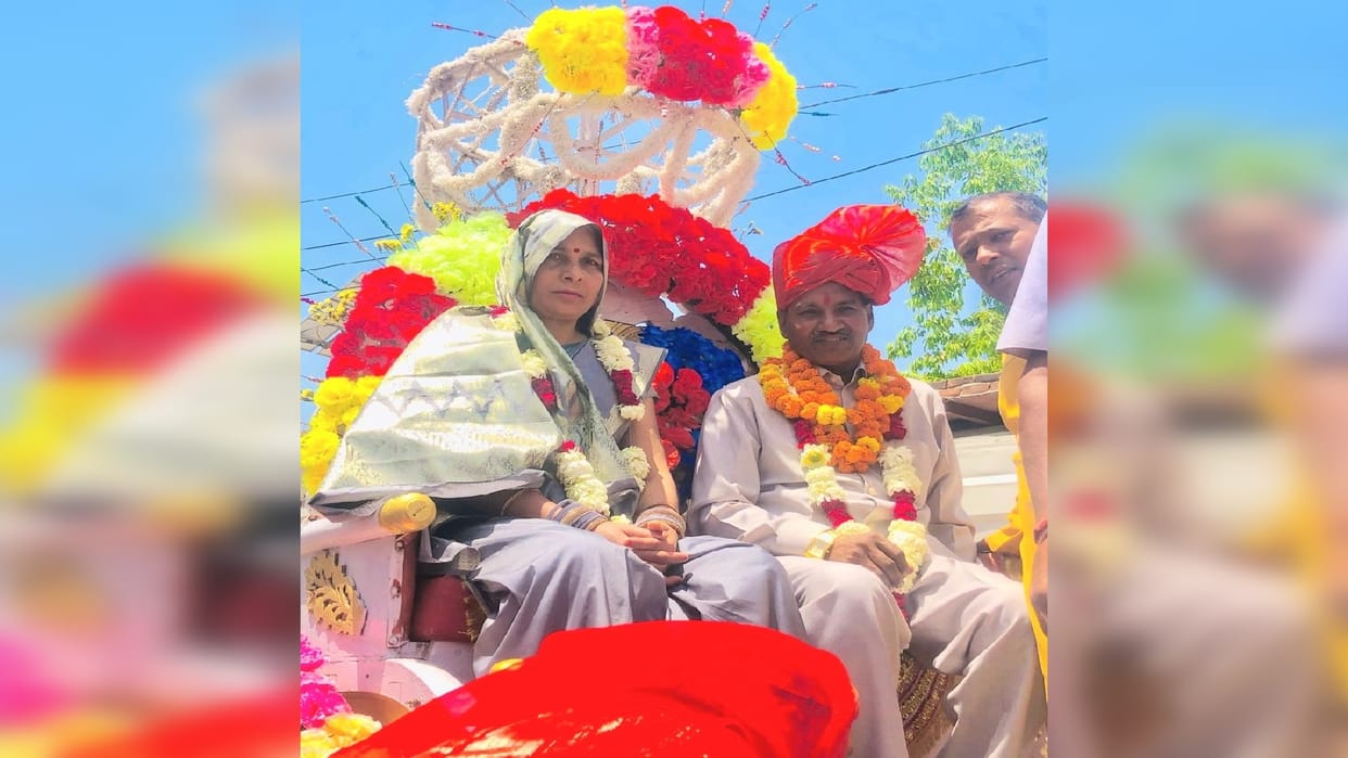 Villagers showered flowers on a retired Class IV employee sitting in carriage
